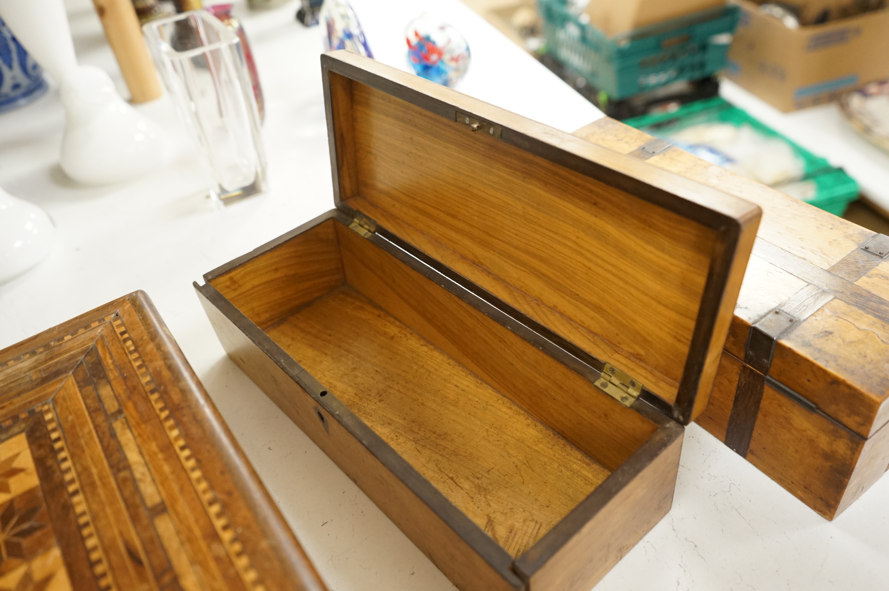 Three boxes comprising a Sorrento ware glove box, a marquetry inlaid slope and a rosewood dressing box, largest 39cm wide